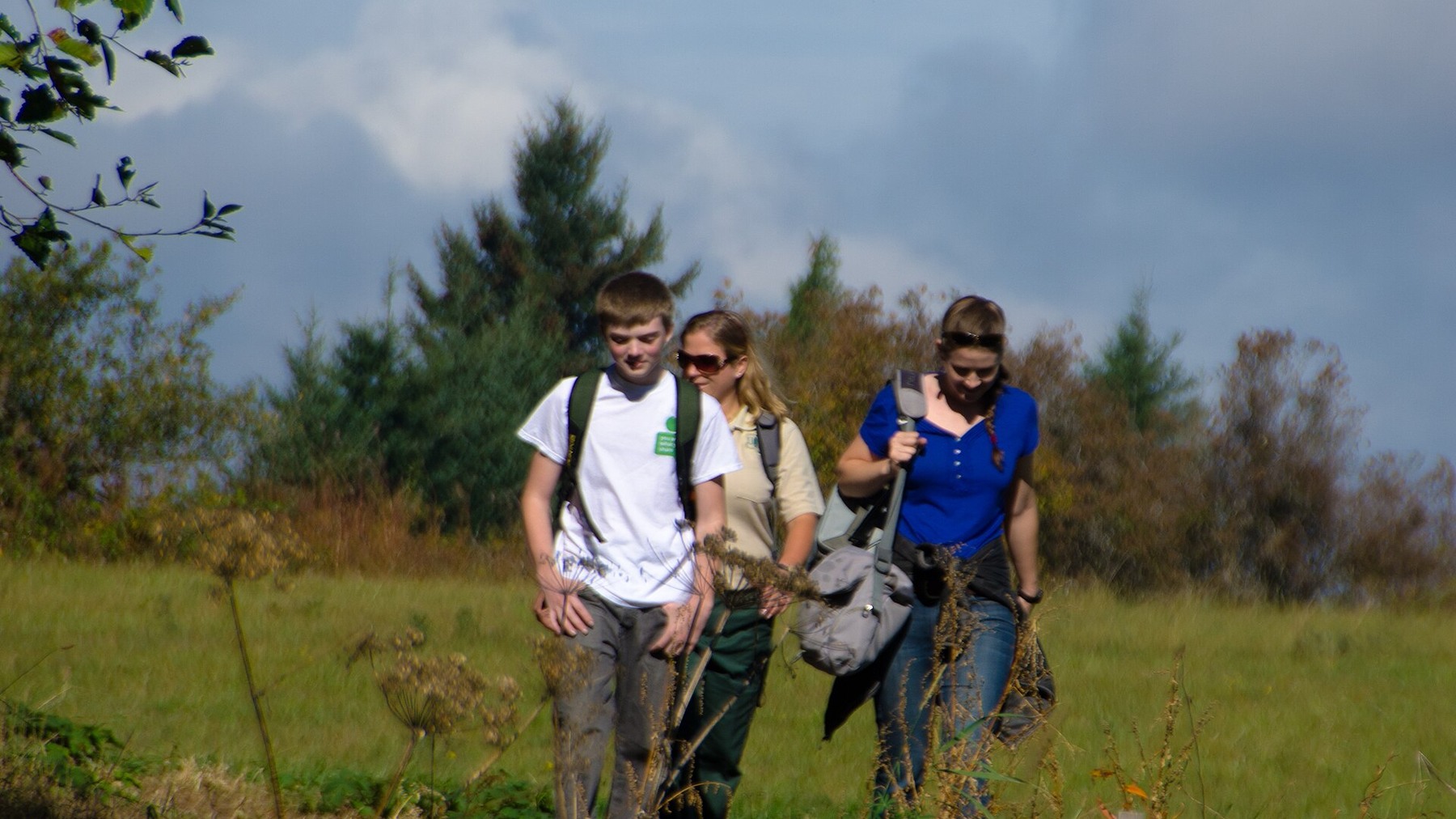 Hikers walking an open section of Cape Horn Trail