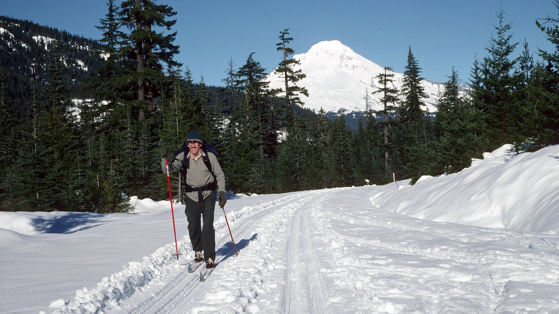 Cross-country skier near Trillium Lake on a bright winter day