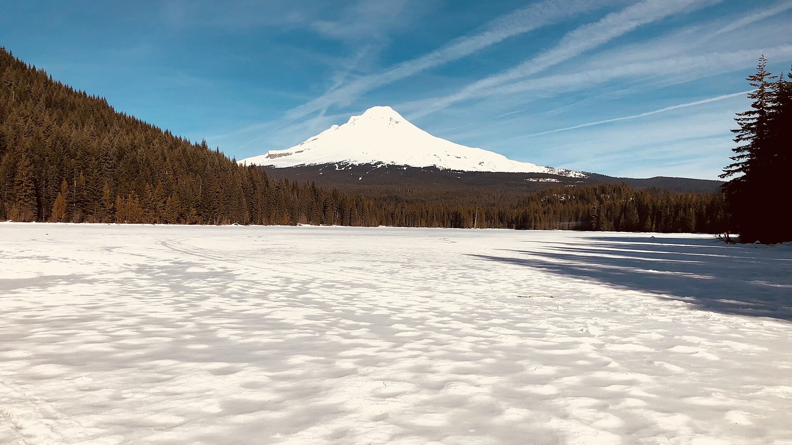 Frozen Trillium Lake surrounded by winter snow