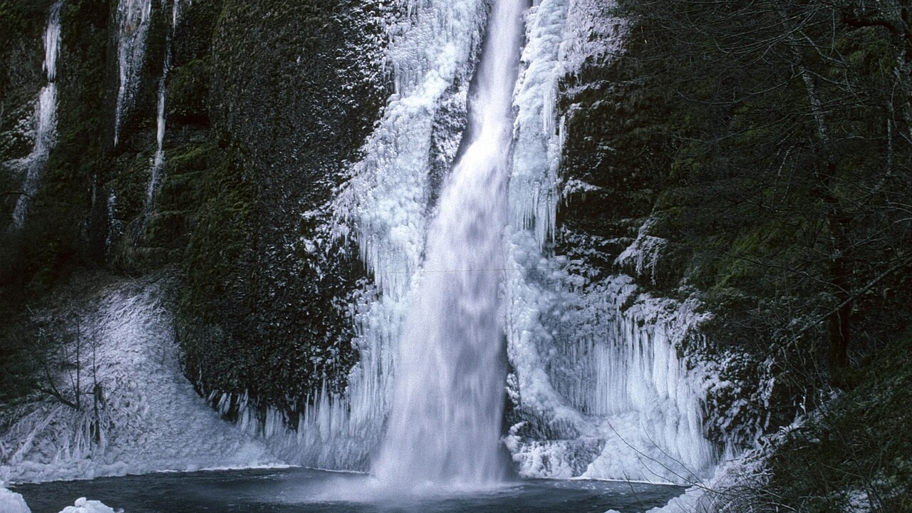 Ice surrounding Horsetail Falls during winter conditions, landscape view