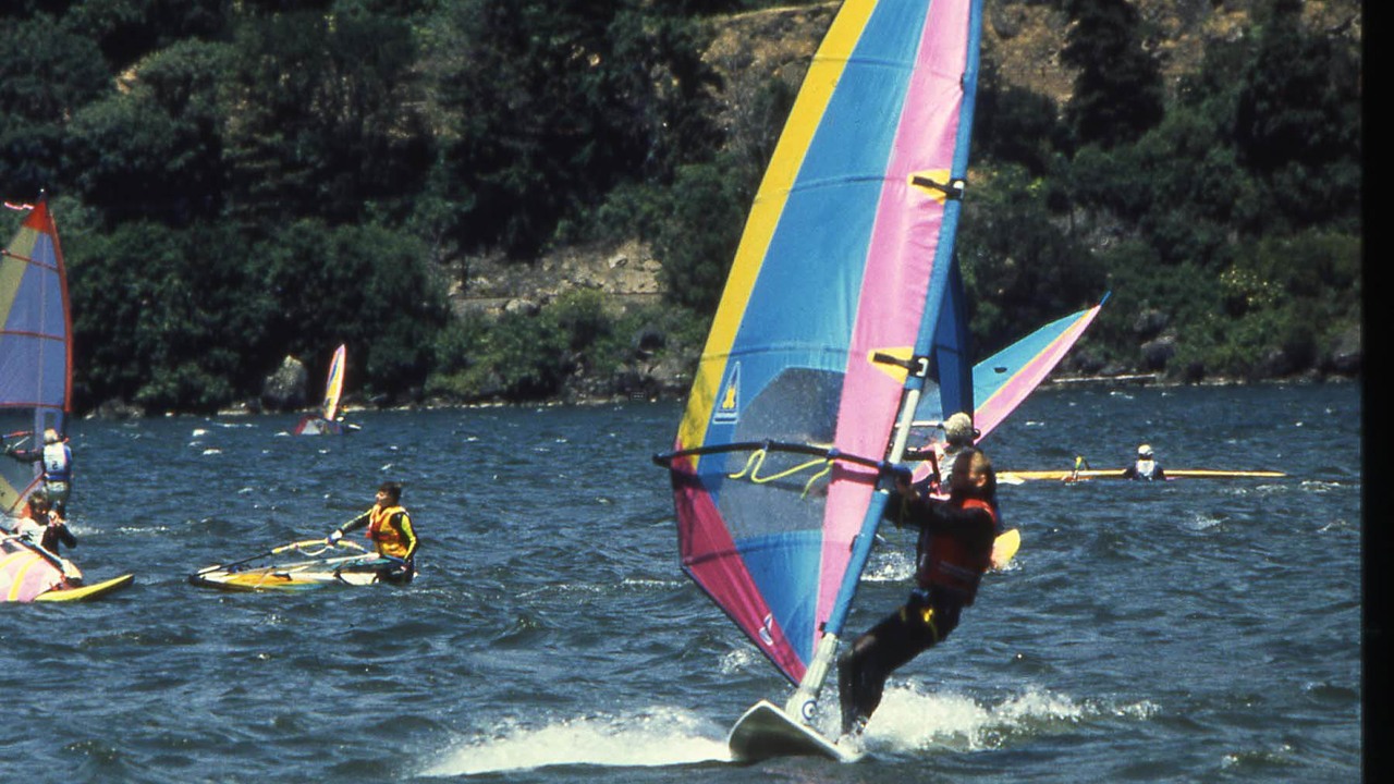 A windsurfer crossing the Columbia River in strong Gorge wind